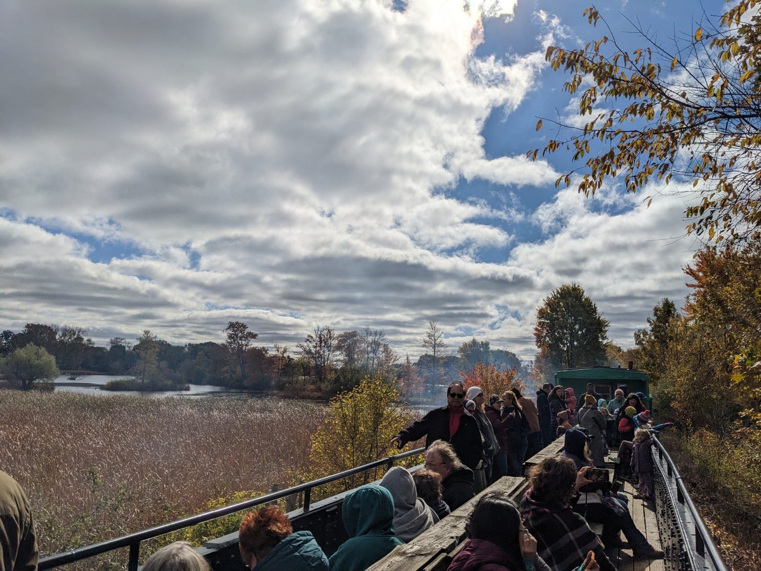 Passengers taking in the sights over Red Millpond in the open air gondola.